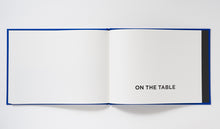 Load image into Gallery viewer, ON THE TABLE 安西水丸
 ร้านหนังสือและสิ่งของ เป็นร้านหนังสือภาษาอังกฤษหายาก และร้านกาแฟ หรือ บุ๊คคาเฟ่ ตั้งอยู่สุขุมวิท กรุงเทพ